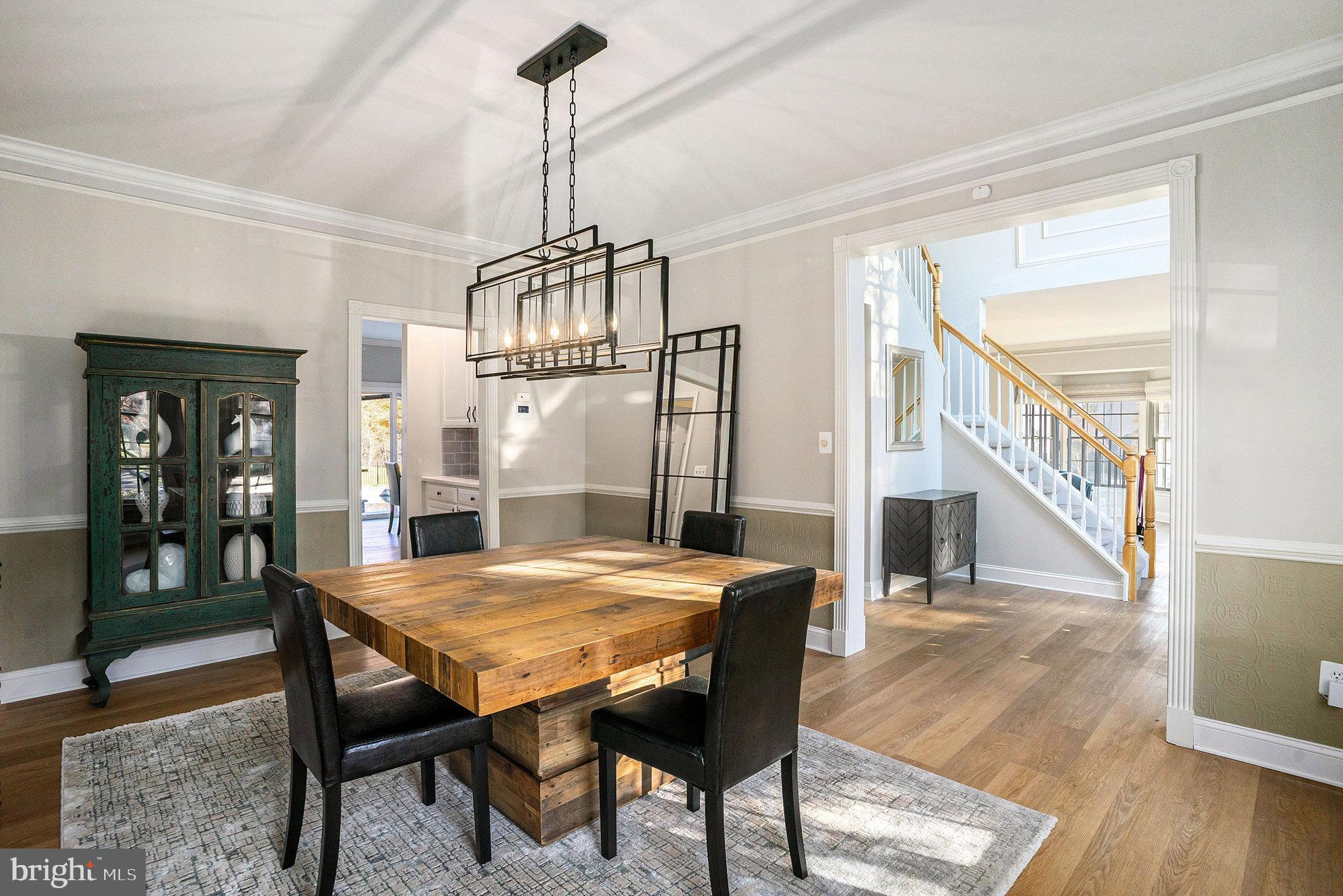 127 Spyglass Drive Blue Bell, PA 19422 - Photo 8 of 74 a view of a dining room and livingroom with furniture wooden floor a chandelier