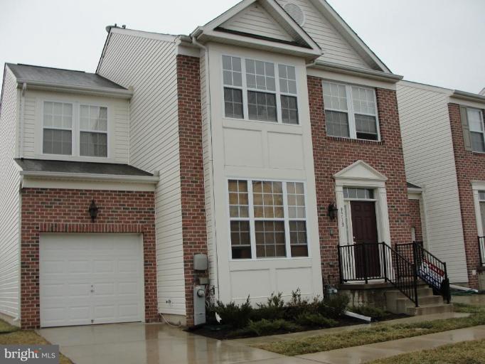 9713 Langley Road Baltimore, MD 21220 - Photo 1 of 1 a front view of a house with a yard