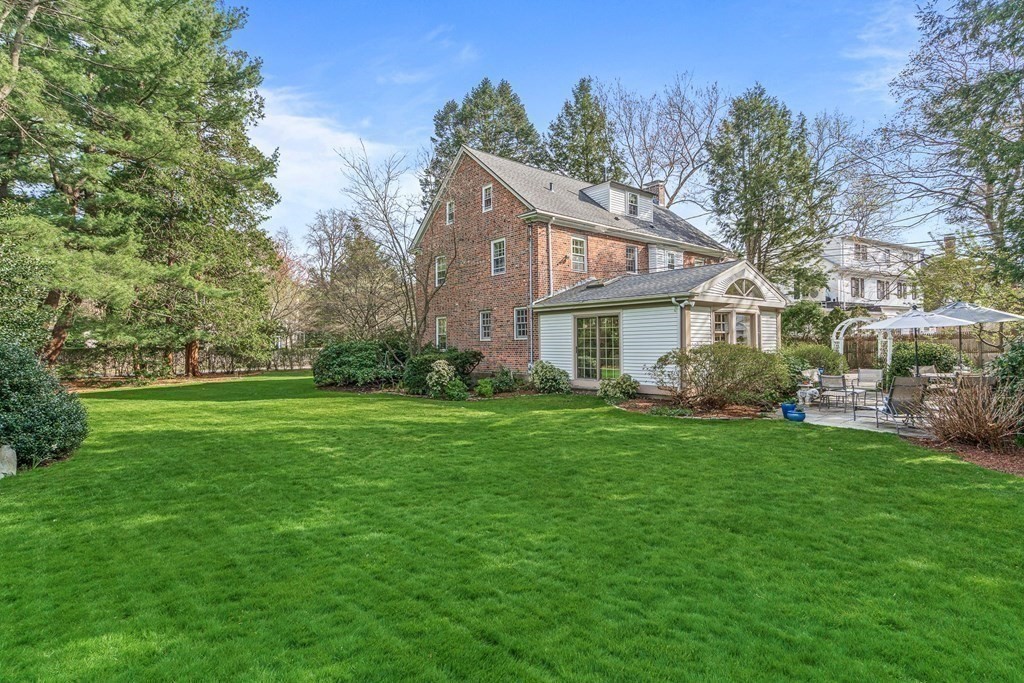 218 Middlesex Road Brookline, MA 02467 - Photo 3 of 30 a front view of a house with a garden