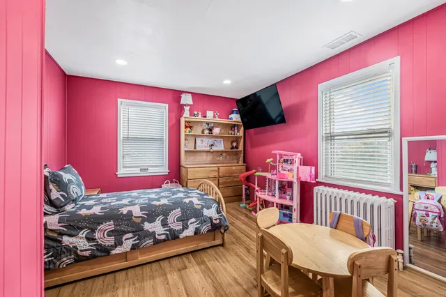 a bedroom with a bed and a closet