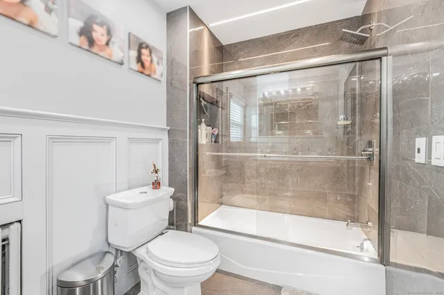 a bathroom with a shower and a toilet