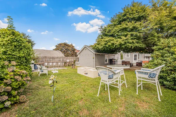 a white table and chairs in a patio