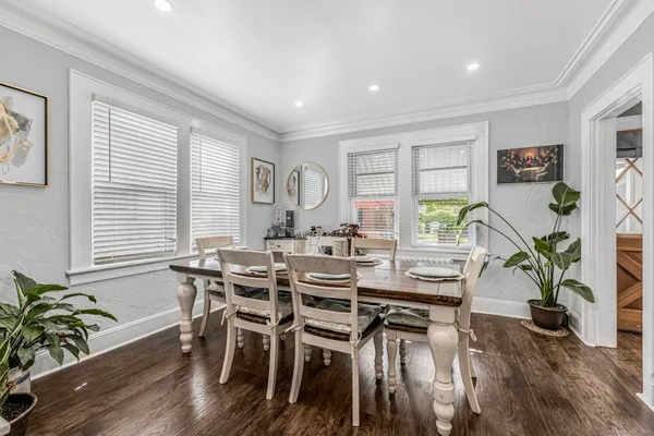 a view of a dining room with furniture and wooden floor
