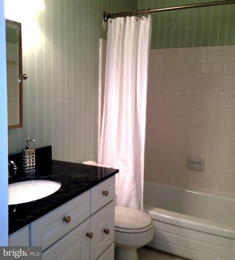 10 Cross Keys Road Baltimore, MD 21210 - Photo 14 of 14 a bathroom with a granite countertop sink toilet and shower