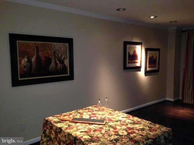10 Cross Keys Road Baltimore, MD 21210 - Photo 4 of 14 a bedroom with a bed and a painting on the wall