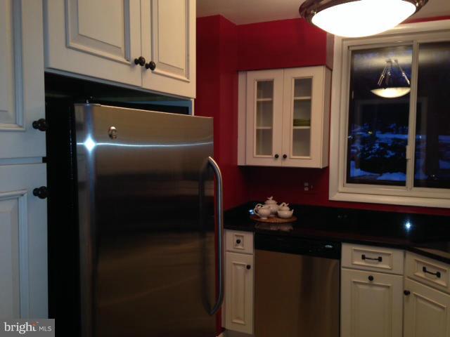 10 Cross Keys Road Baltimore, MD 21210 - Photo 5 of 14 a kitchen with a refrigerator and cabinets