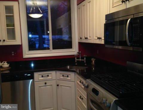 10 Cross Keys Road Baltimore, MD 21210 - Photo 6 of 14 a kitchen with a sink and cabinets