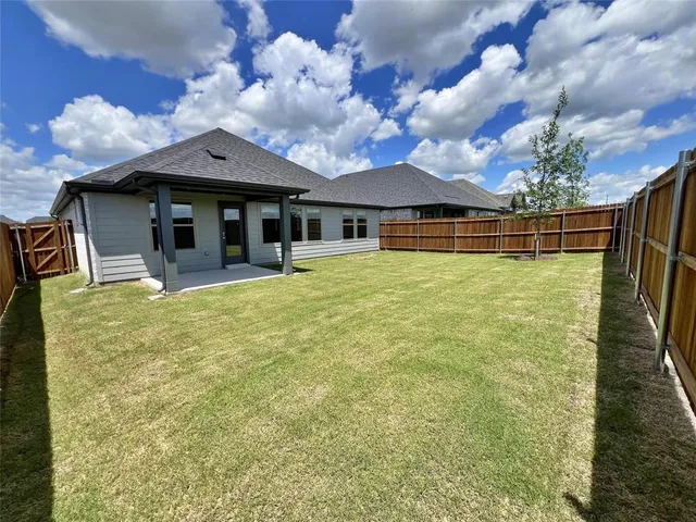 a view of a house with basketball court