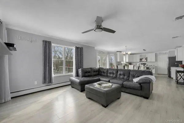 a living room with furniture and a window