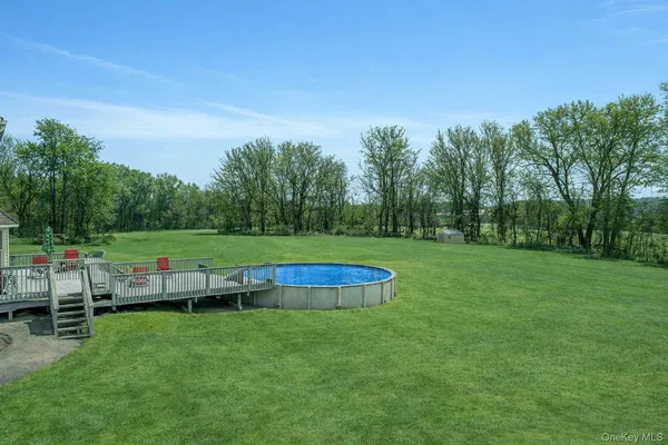 a view of garden with lawn chairs