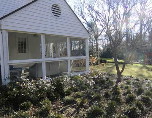 30 Point O Woods Road Darien, CT 06820 - Photo 13 of 16 a backyard of a house with table and chairs