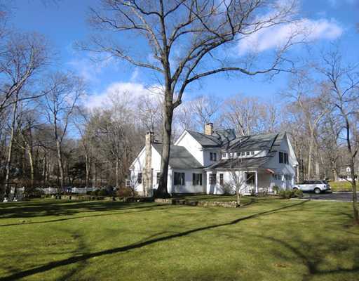 30 Point O Woods Road Darien, CT 06820 - Photo 16 of 16 a front view of a building with trees