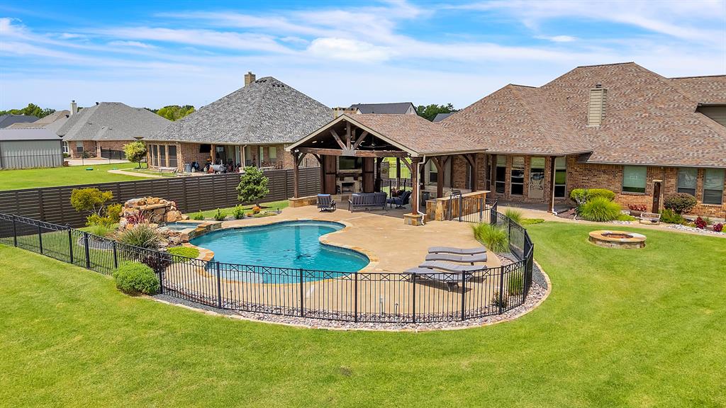 12286 Emerald Ranch Lane North Forney, TX 75126 - Photo 1 of 40 Beautiful outdoor living area with pool, spa and waterfall