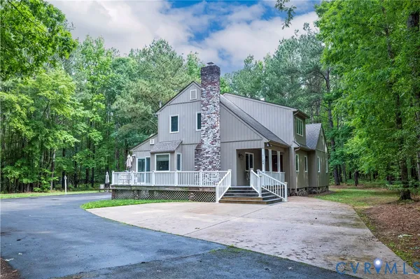a front view of a house with a yard patio and fire pit