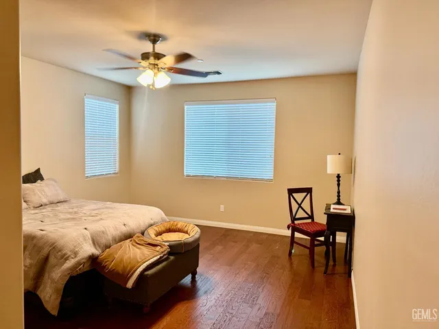 a bedroom with a bed and a table