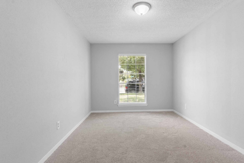 7403 Strawbridge Lane Houston, TX 77040 - Photo 20 of 22 an empty room with a window