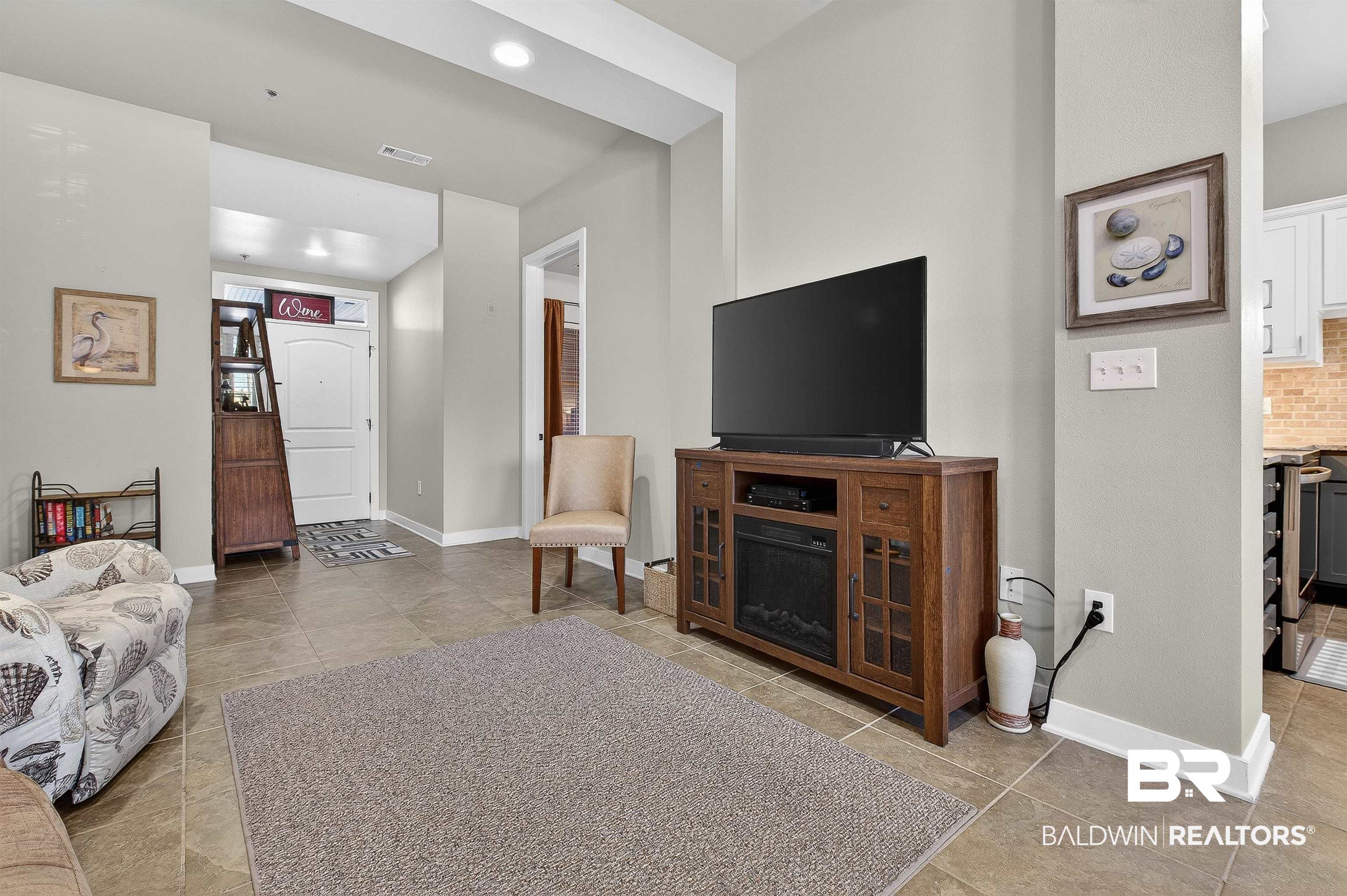 1430 West Regency Road, Unit I102 Gulf Shores, AL 36542 - Photo 6 of 31 Living room featuring light tile patterned flooring and recessed lighting