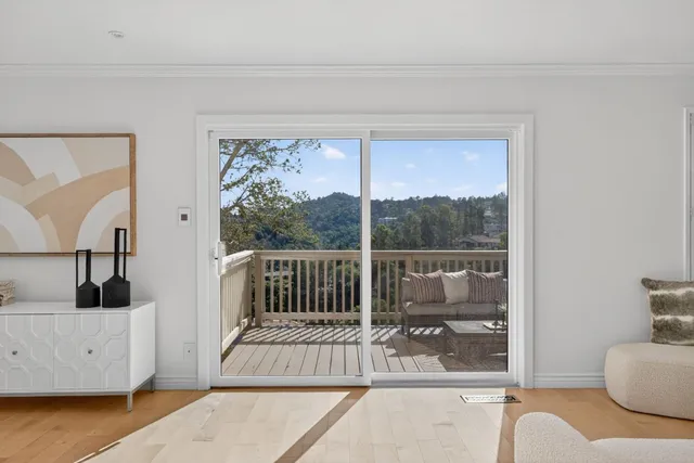 a bedroom with a large bed and a large window