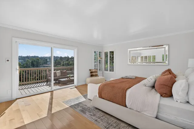 a spacious bedroom with a bed and a couch