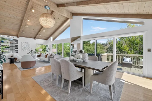 a view of a dining room with furniture window and outside view