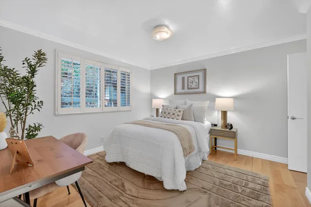 a bedroom with a bed and a couch