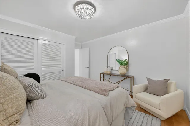 a bathroom with a sink mirror and toilet