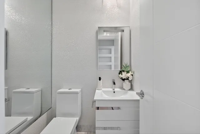 a bedroom with a bed and a table