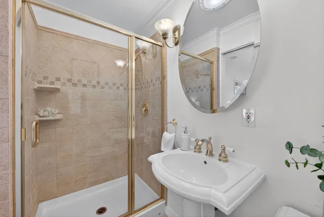 a view of a balcony with wooden floor and outdoor seating