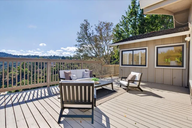 a view of a city with lush green forest