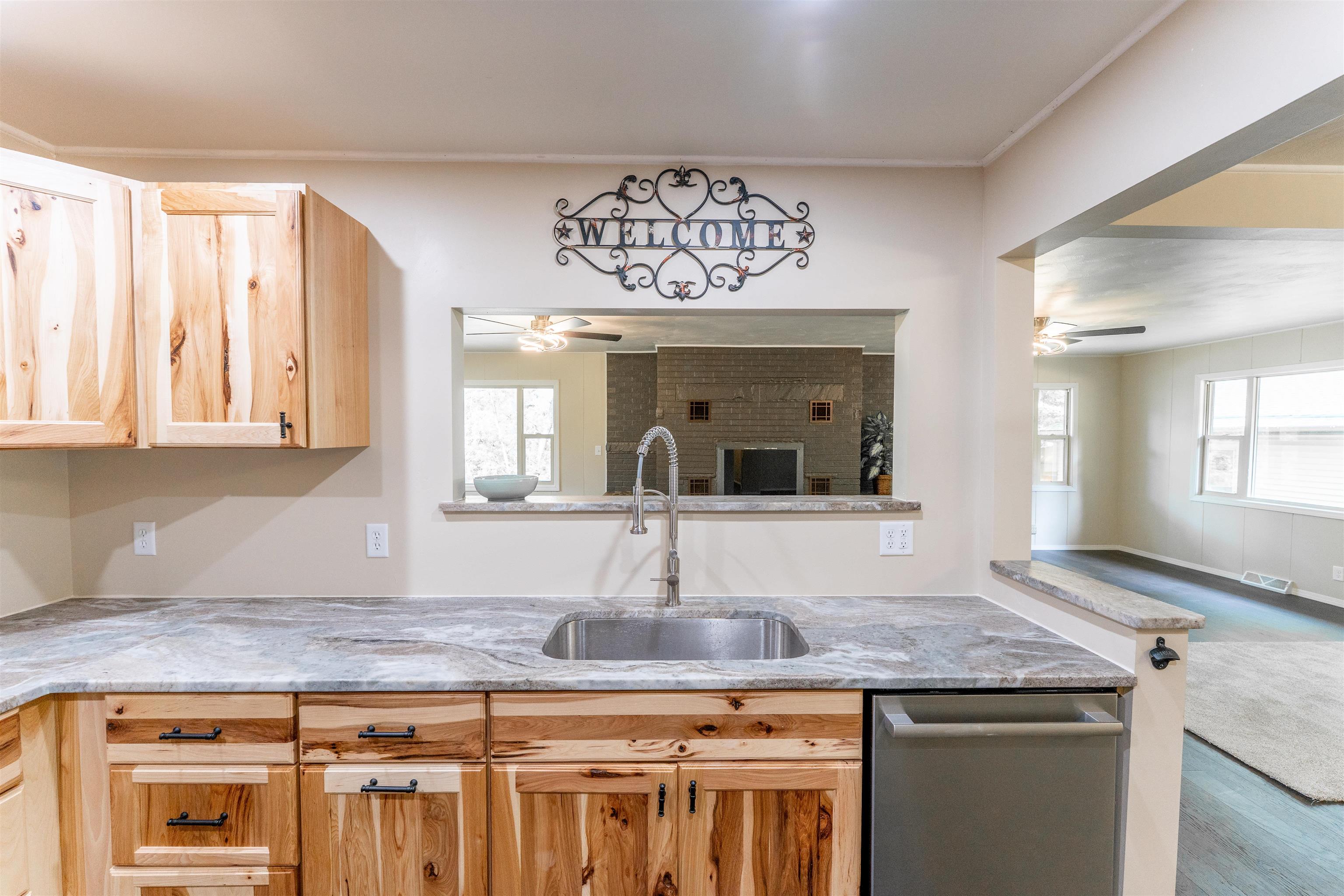 1162 South Bradley Road Oregon, IL 61061 - Photo 22 of 78 a kitchen with kitchen island granite countertop a sink and cabinets