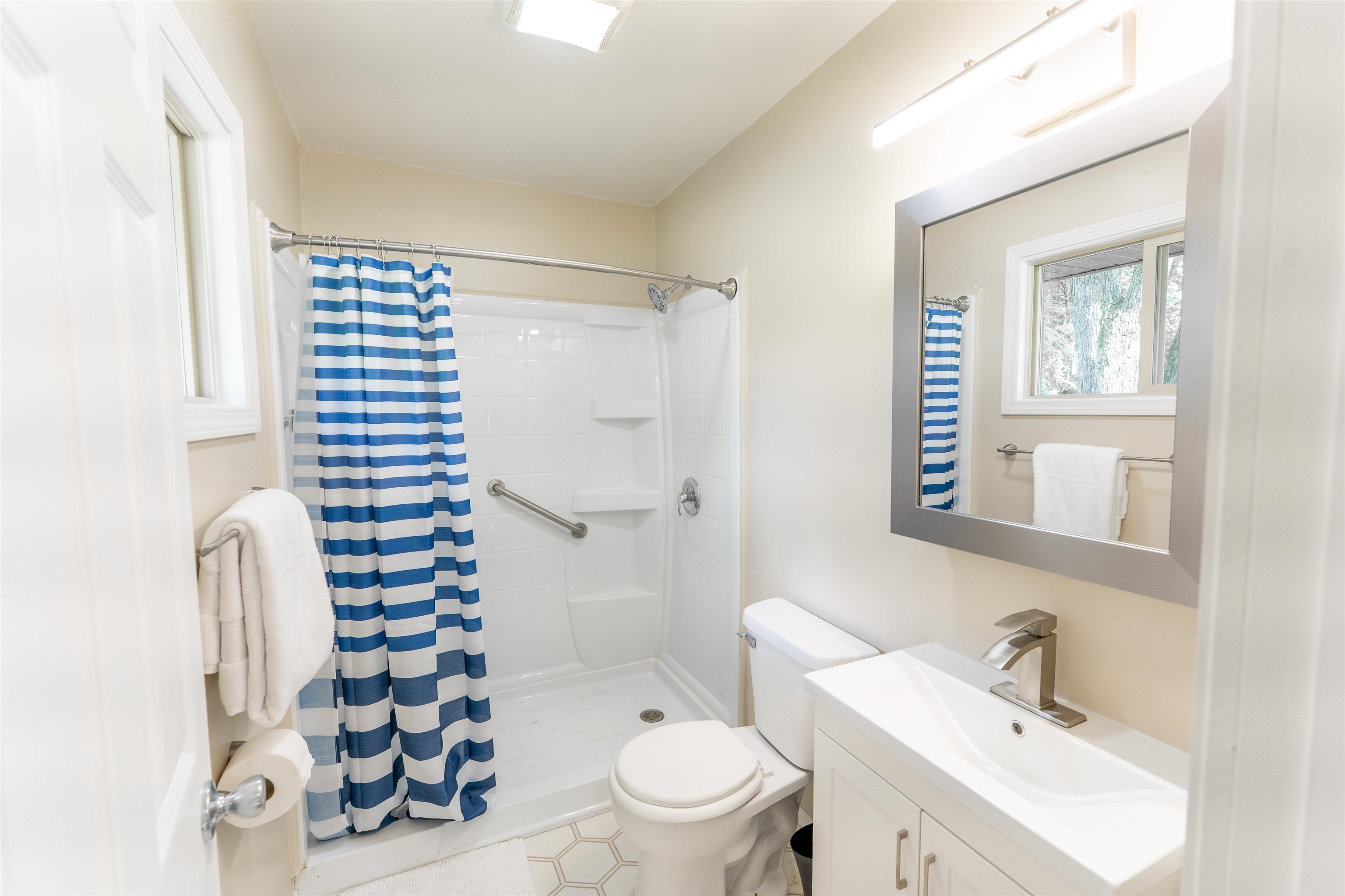 1162 South Bradley Road Oregon, IL 61061 - Photo 33 of 78 a bathroom with a sink a toilet a shower and a mirror