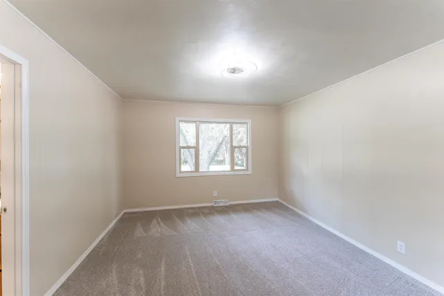 a backyard of a house with lots of green space