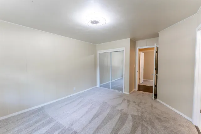 a backyard of a house with lots of green space