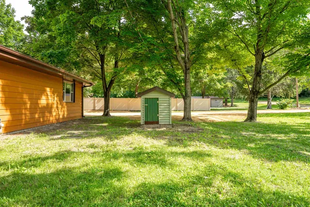 an aerial view of a house with pool yard outdoor seating and yard