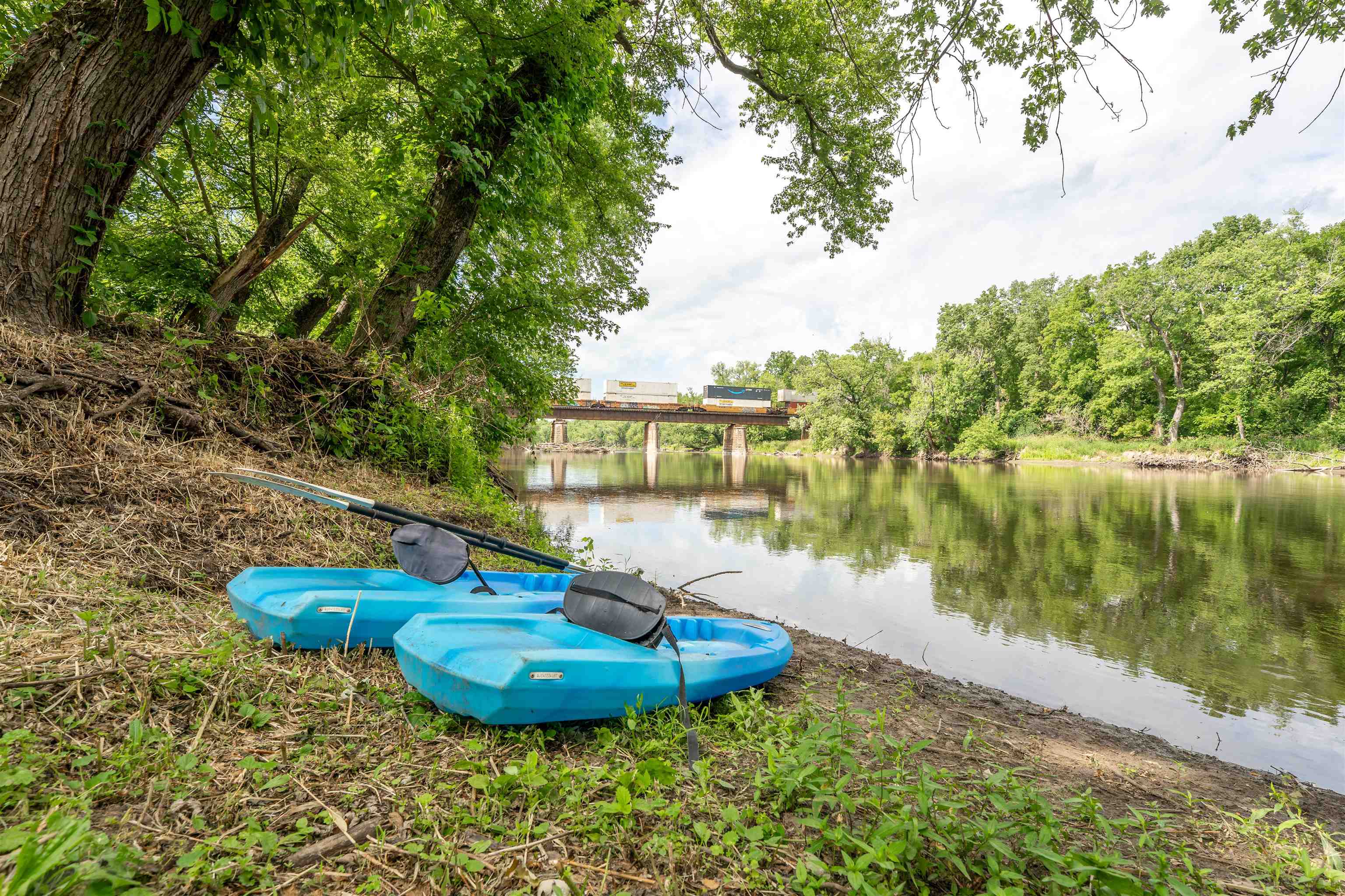 1162 South Bradley Road Oregon, IL 61061 - Photo 56 of 78 a view of a lake with a yard and large trees