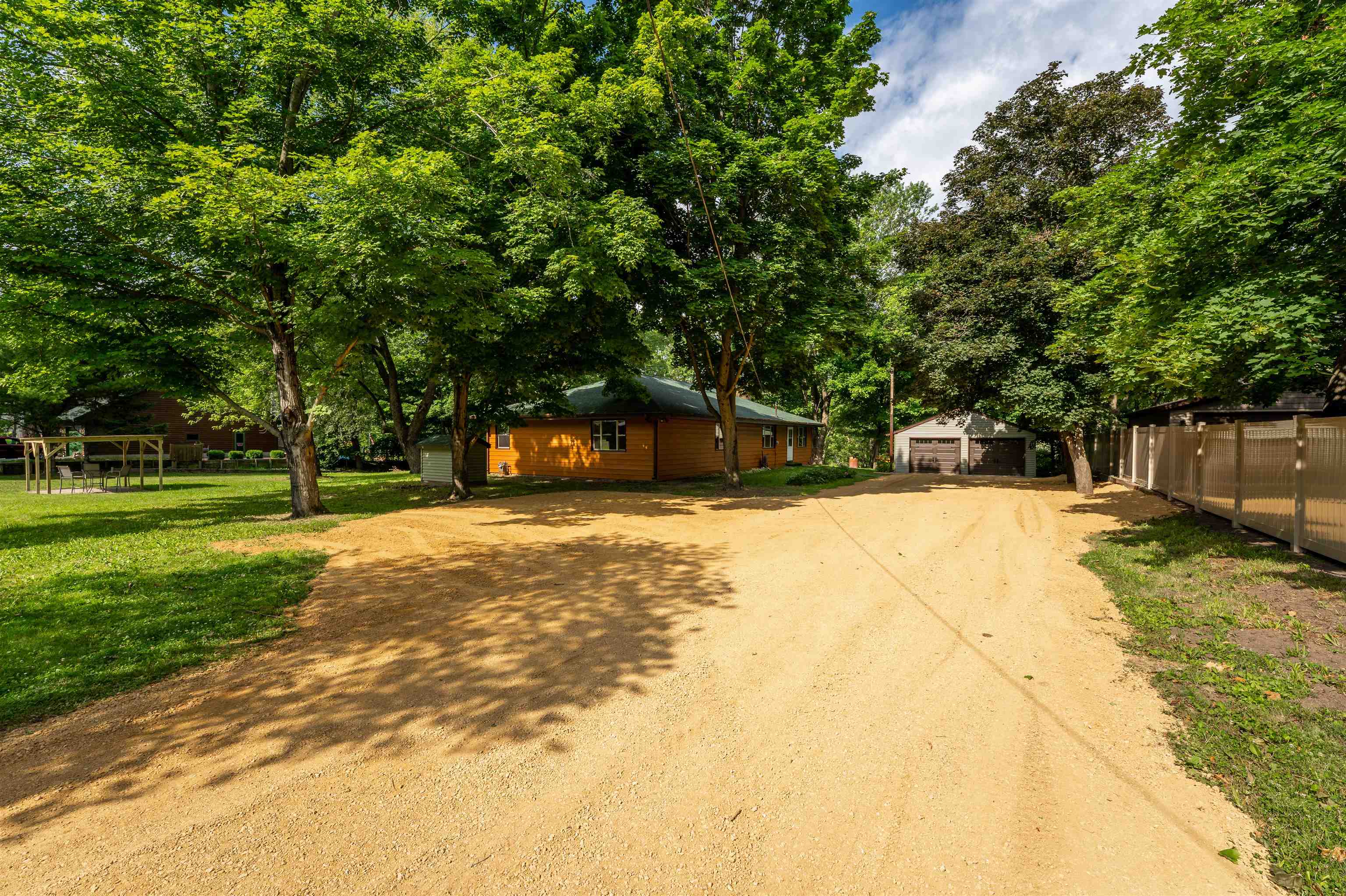 1162 South Bradley Road Oregon, IL 61061 - Photo 6 of 78 a view of a swimming pool with a house in the background