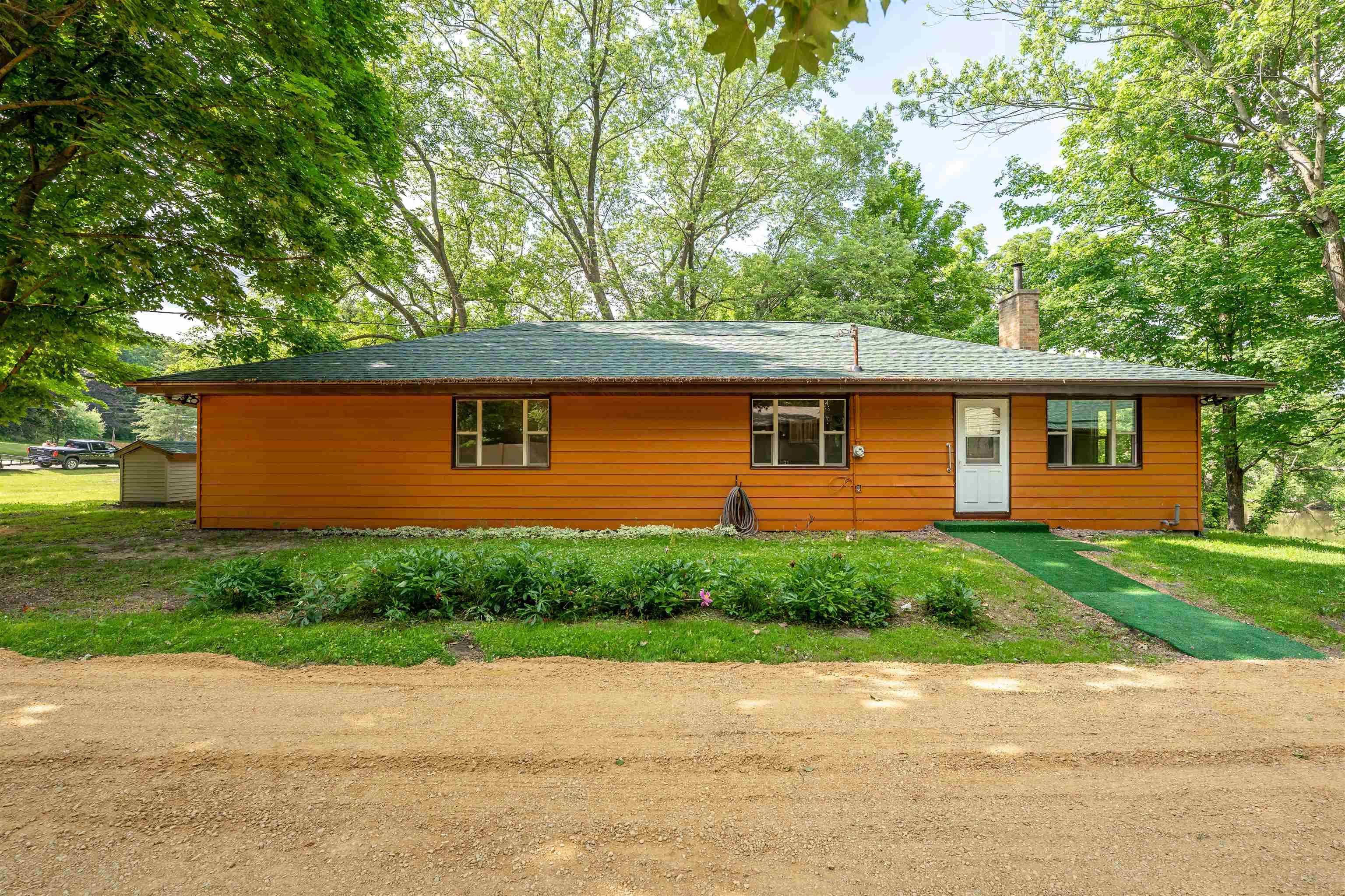 1162 South Bradley Road Oregon, IL 61061 - Photo 8 of 78 a front view of a house with a yard and a garage