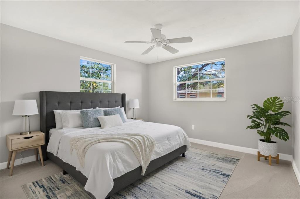 4455 Rustic Drive New Port Richey, FL 34652 - Photo 17 of 27 a bedroom with bed plant and window