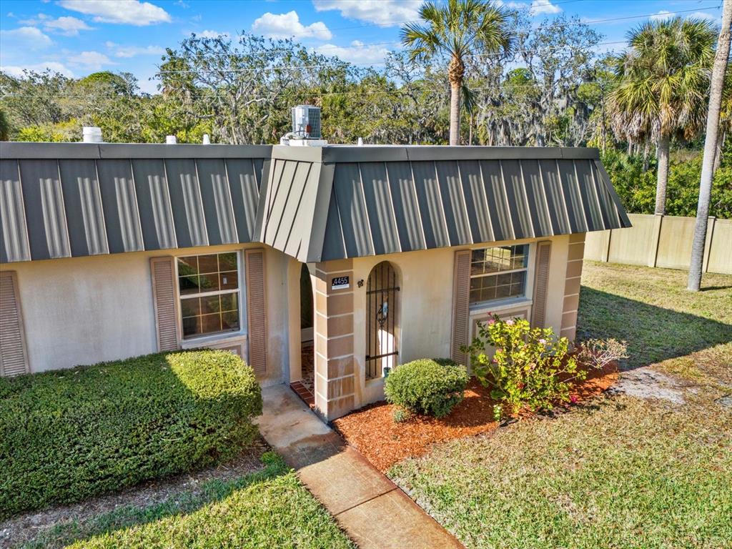 4455 Rustic Drive New Port Richey, FL 34652 - Photo 2 of 27 a view of a backyard with sitting area
