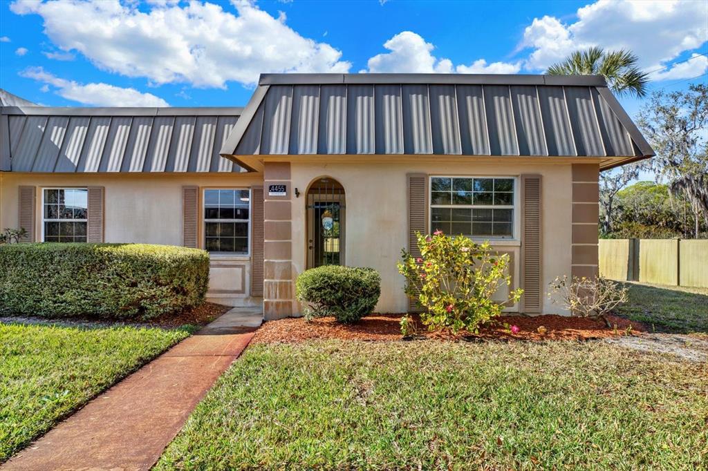 4455 Rustic Drive New Port Richey, FL 34652 - Photo 26 of 27 a front view of a house with yard porch and furniture