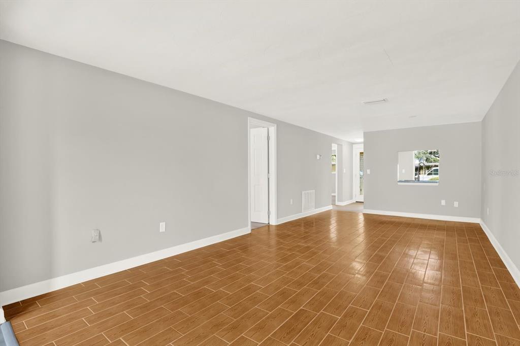4455 Rustic Drive New Port Richey, FL 34652 - Photo 10 of 27 a view of empty room with wooden floor