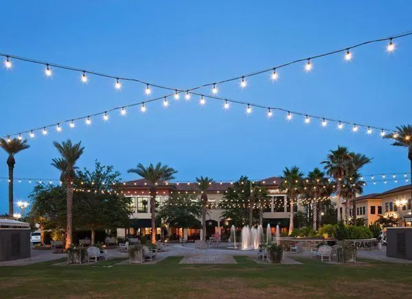 a view of swimming pool with outdoor seating and city view