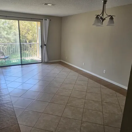 a view of an empty room and a window