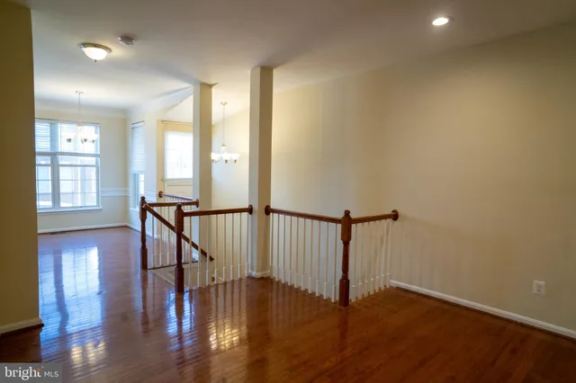 a view of an entryway with wooden floor