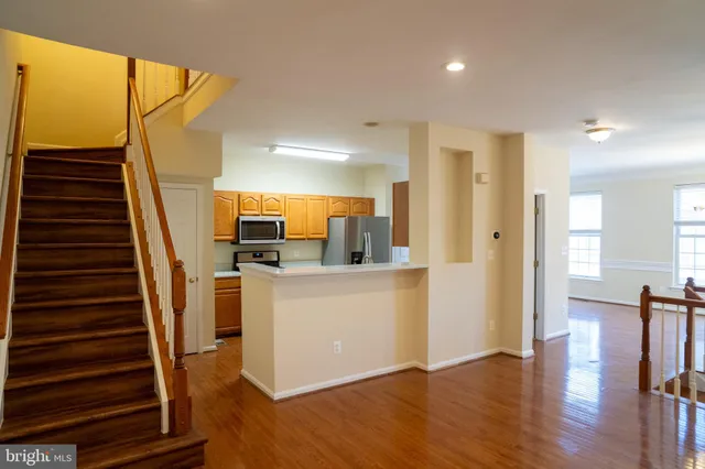 a view of kitchen with furniture and wooden floor
