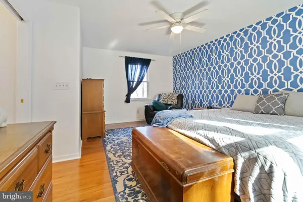 a bedroom with bed and window