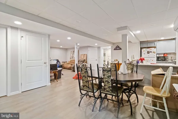 a kitchen with a sink appliances cabinets and a counter top space