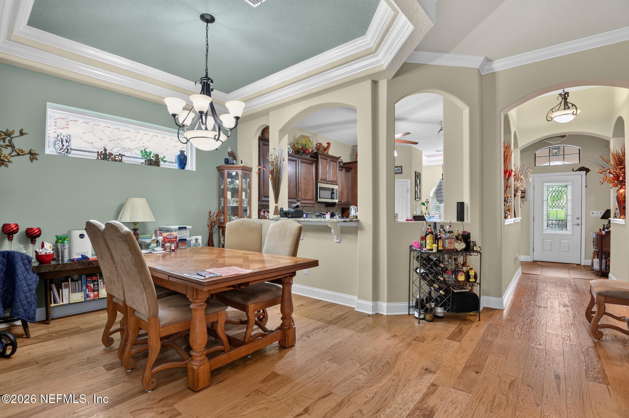 110 Vía Roma Ormond Beach, FL 32174 - Photo 17 of 43 a view of a dining room with furniture and chandelier
