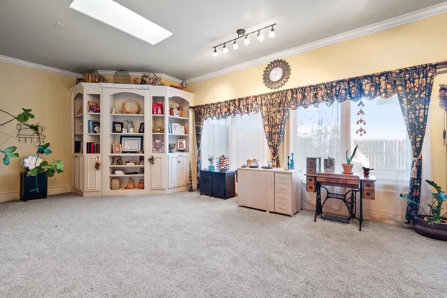 a view of a livingroom with furniture and window