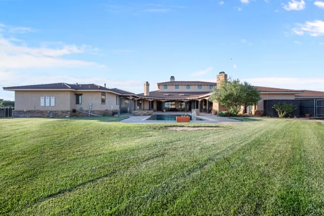 a view of house with outdoor space and porch